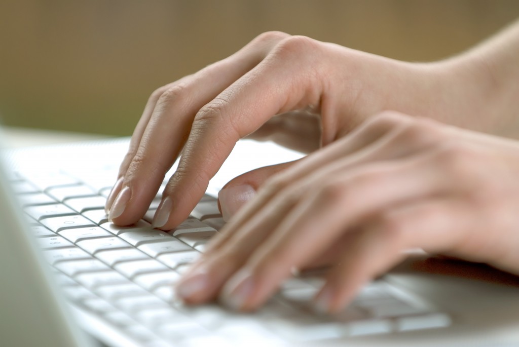 Computer keyboard with female hands